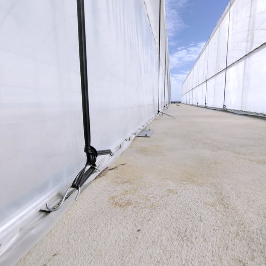 close up of greenhouse film tension rope